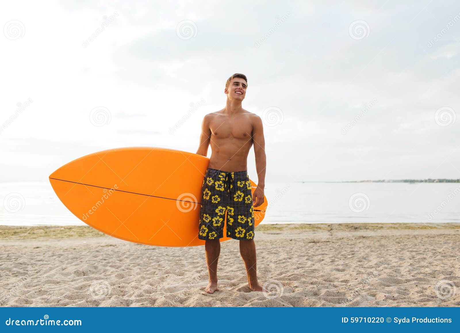 Smiling Young Man with Surfboard on Beach Stock Photo - Image of ...