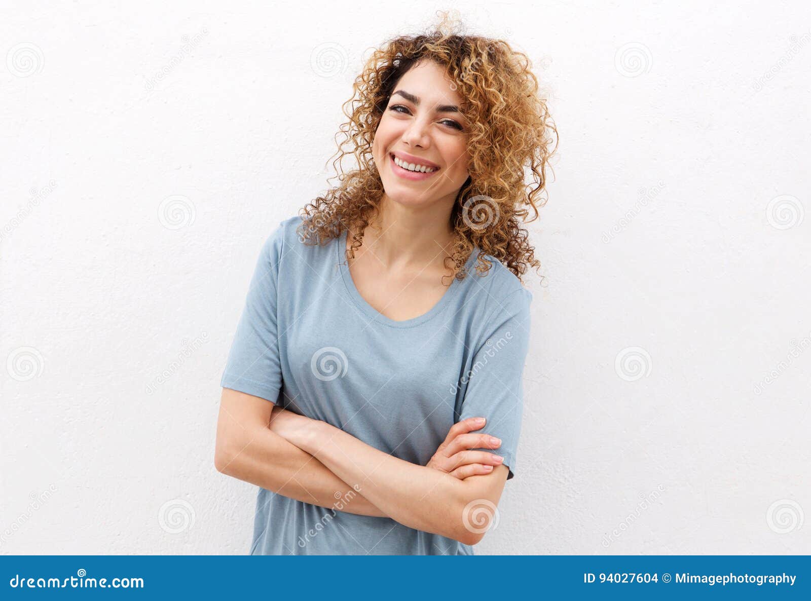 Smiling Young Woman Against Isolated White Background Stock Photo ...