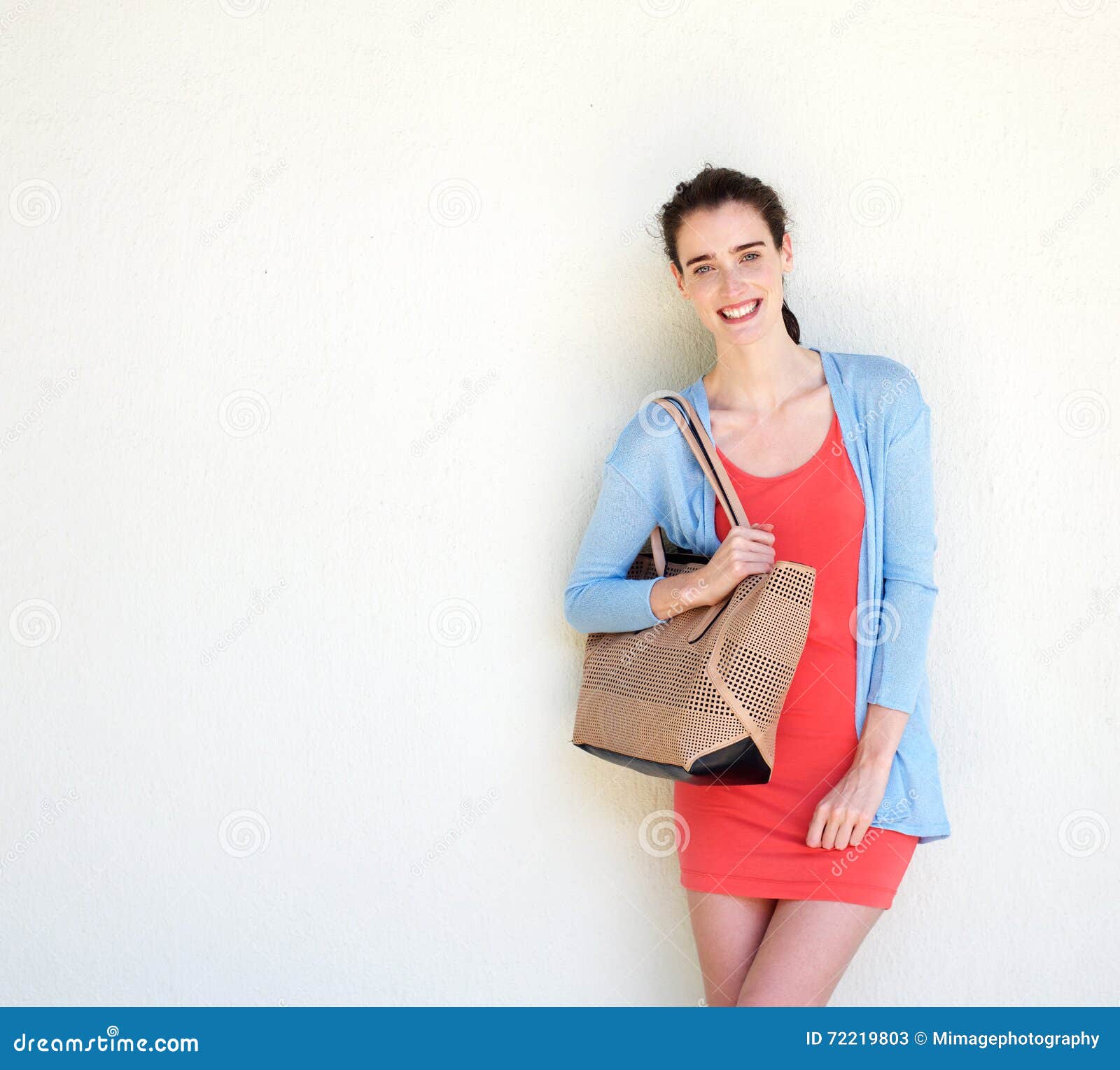 Pretty Young Woman Carrying A Purse And Some Shopping Bags While Visiting A  Shopping Center Stock Photo, Picture and Royalty Free Image. Image 51571974.