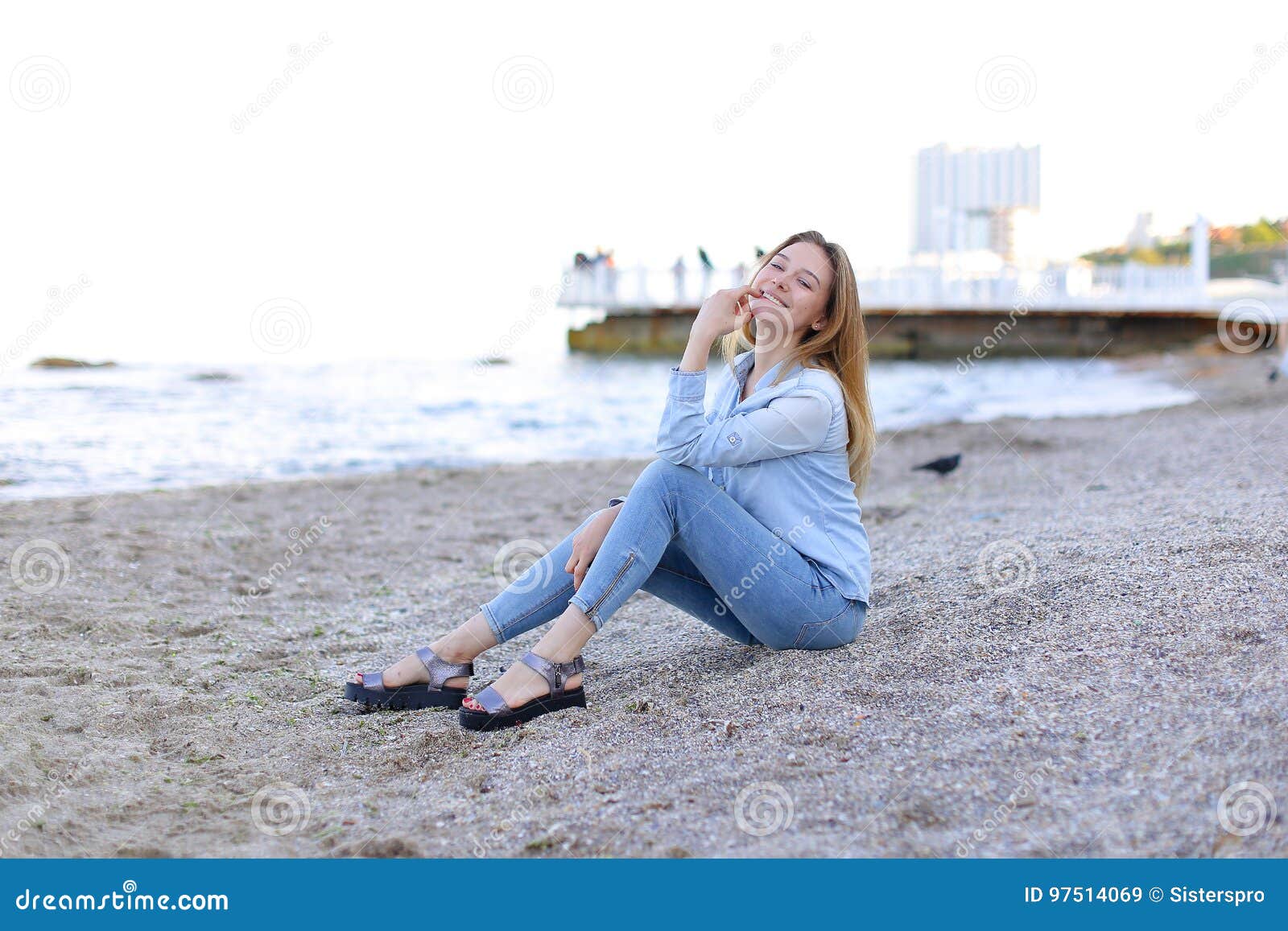 A girl takes a selfie on a beautiful beach, poses with a smartphone  25645836 Stock Video at Vecteezy
