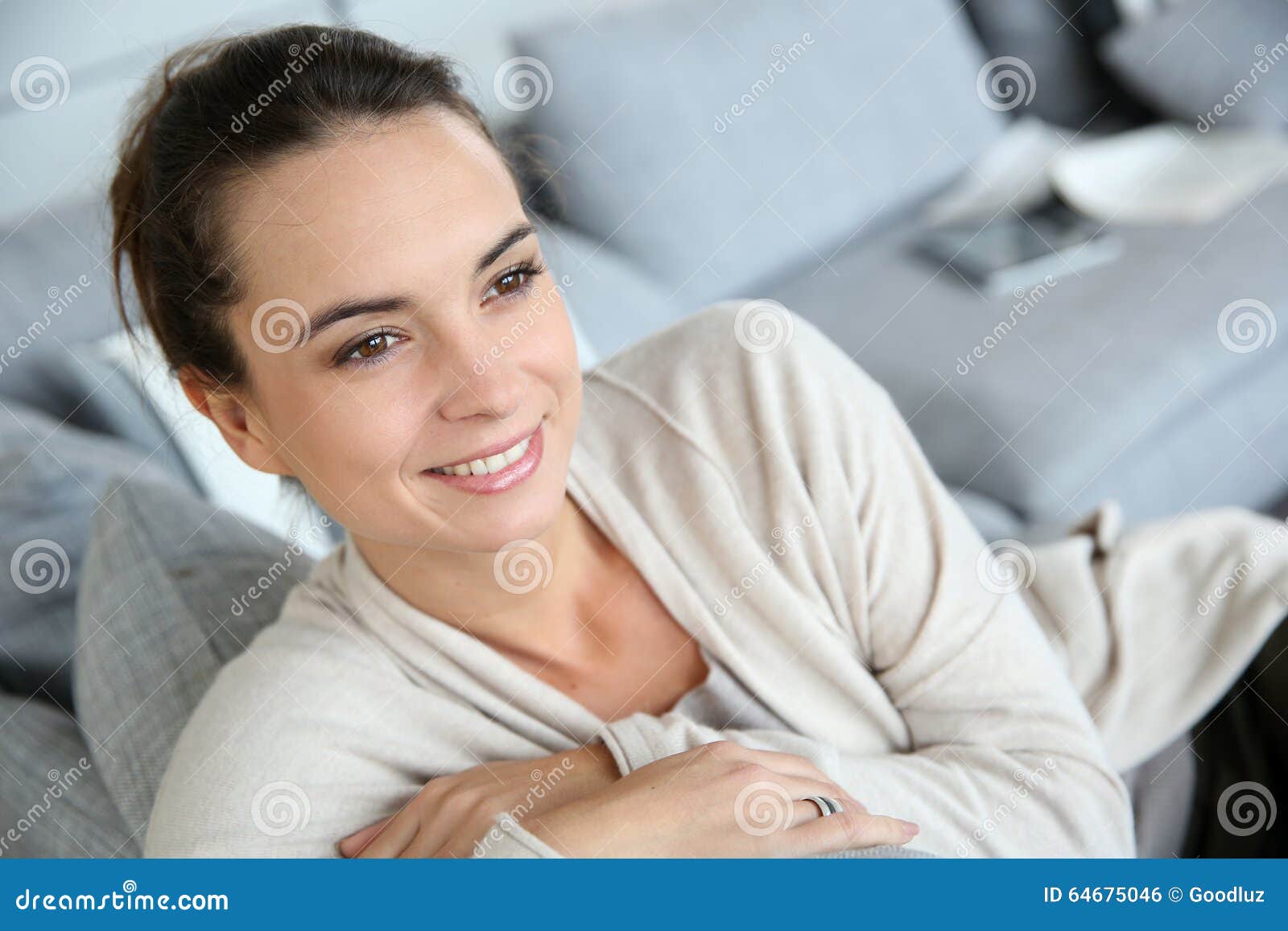 Smiling Young Woman Sitting on the Couch Stock Photo - Image of people ...