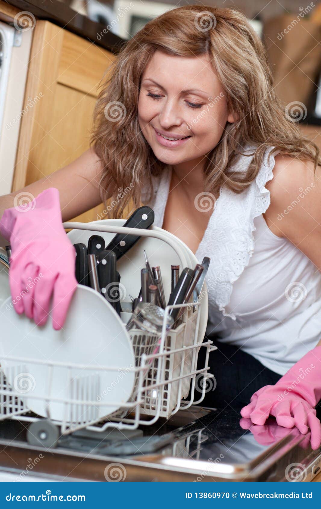 Smiling Young Woman Using a Dishwasher Stock Photo Image of indoor
