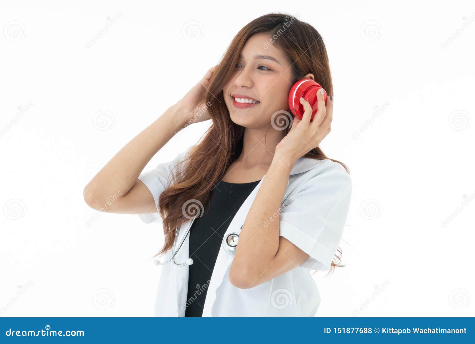 a smily woman doctor wearing a red headphones with a sthethoscope on her neck