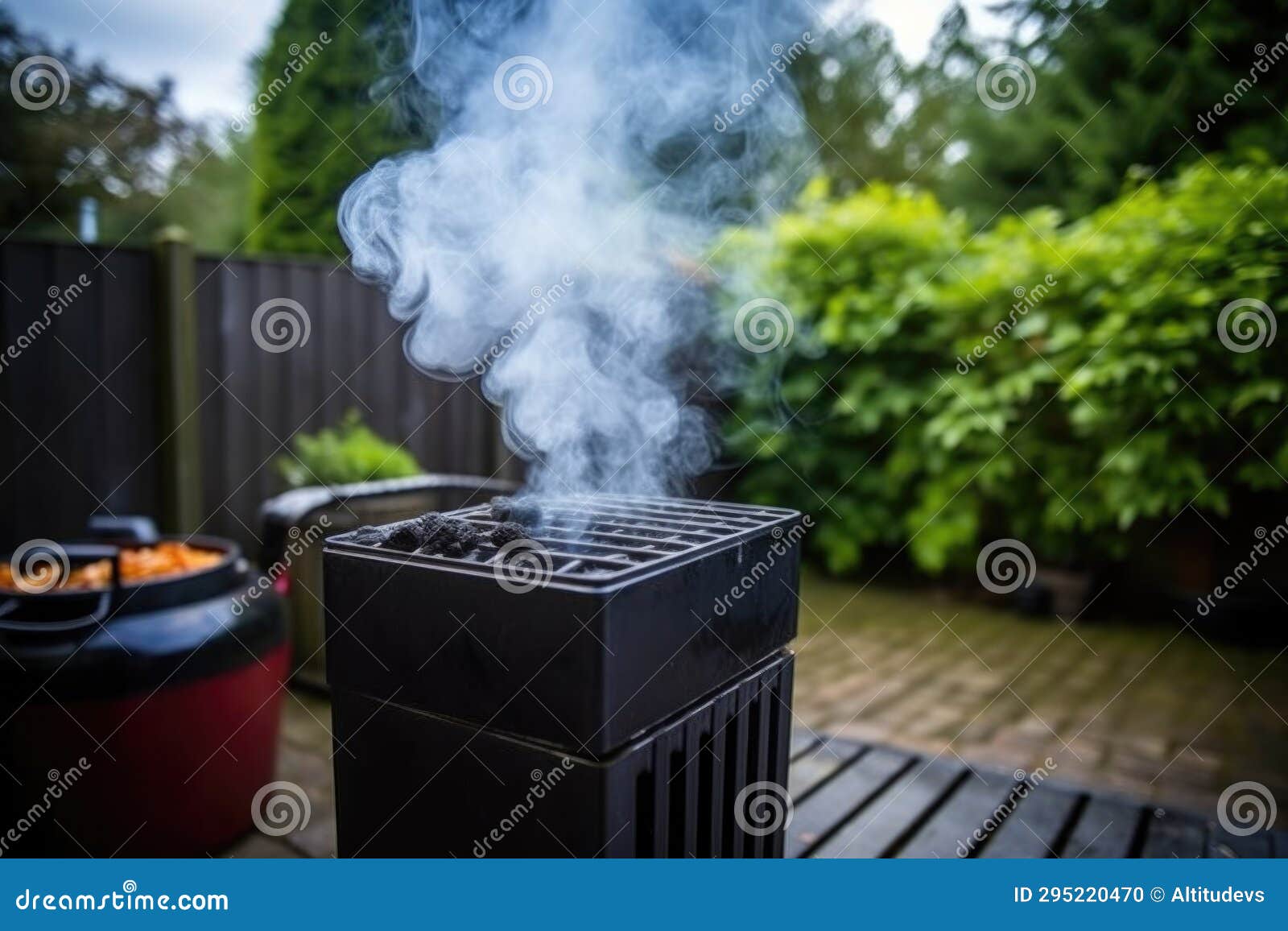 Smoke Emerging from a Black Chimney Starter Full of Burning Charcoals
