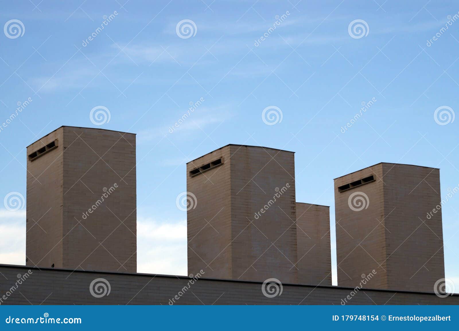 Smoke Extraction Chimneys Located on Top of the Building Stock Photo