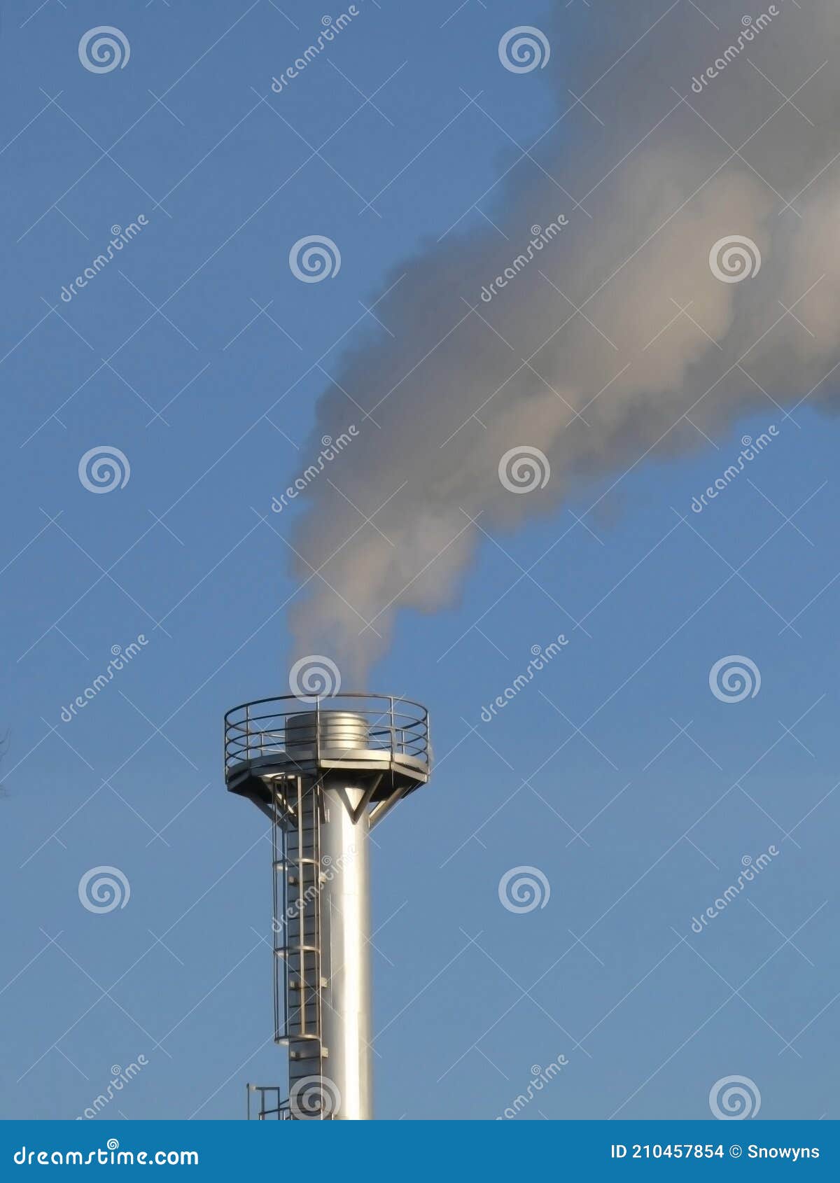smoke spews out of a chimney at an industrial plant