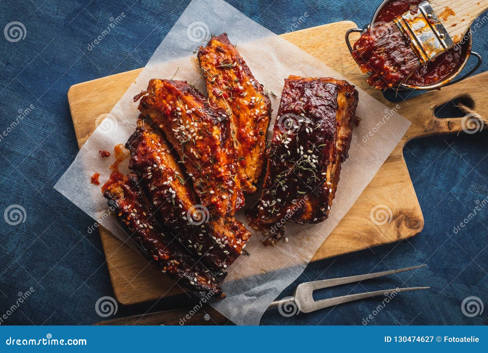 smoked roasted pork ribs over blue background. barbeque spicy ri