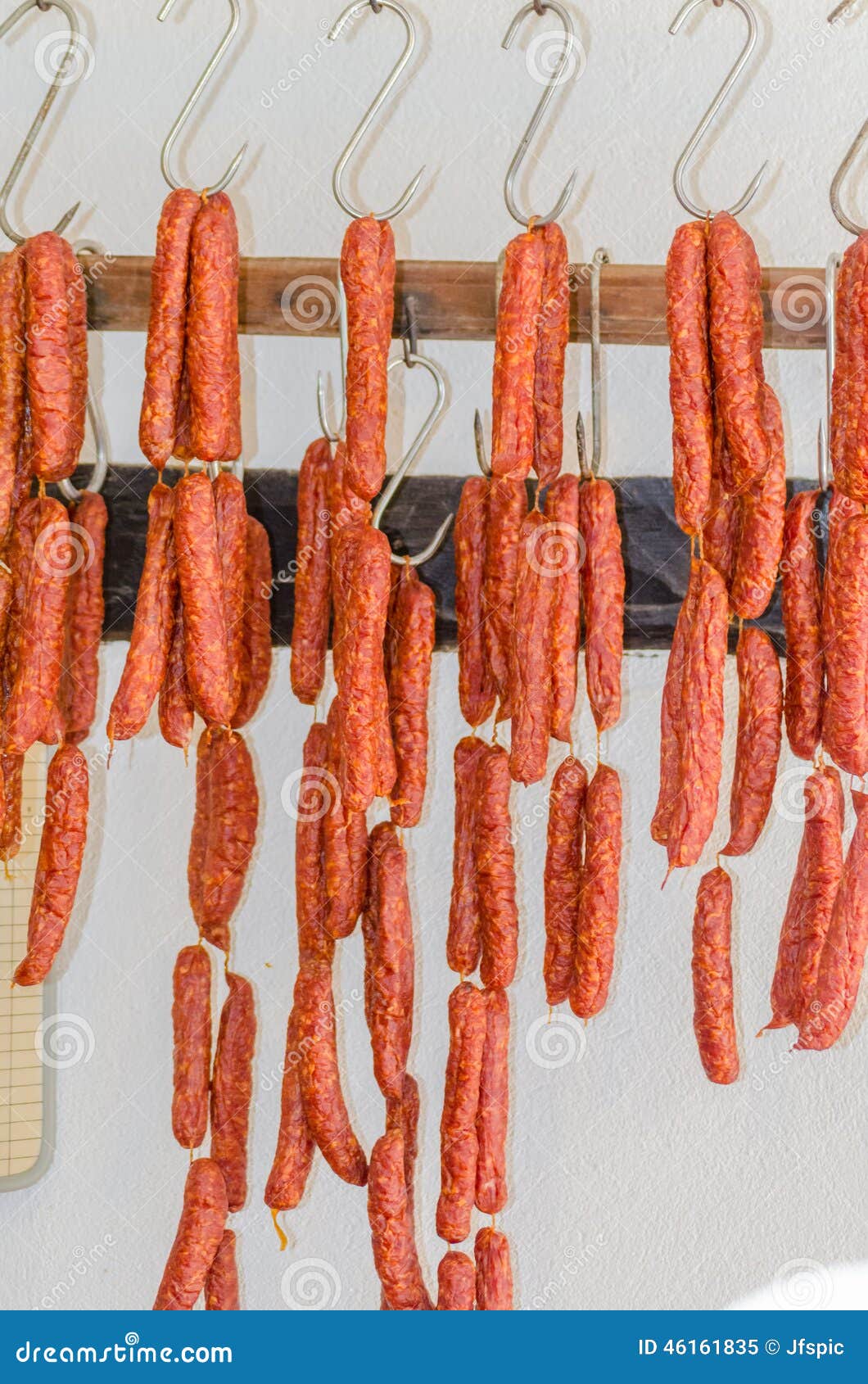 smoked sausages, meats in butcher's shop.
