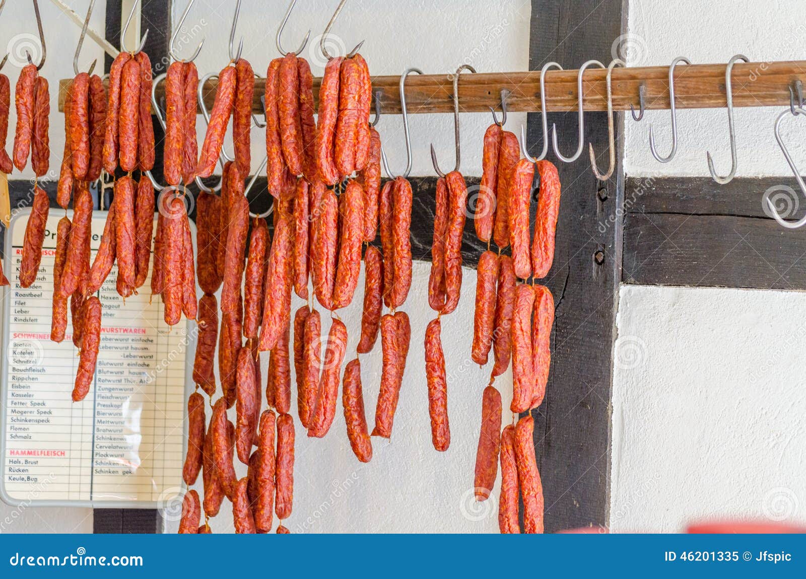 smoked sausages, meats in butcher's shop.