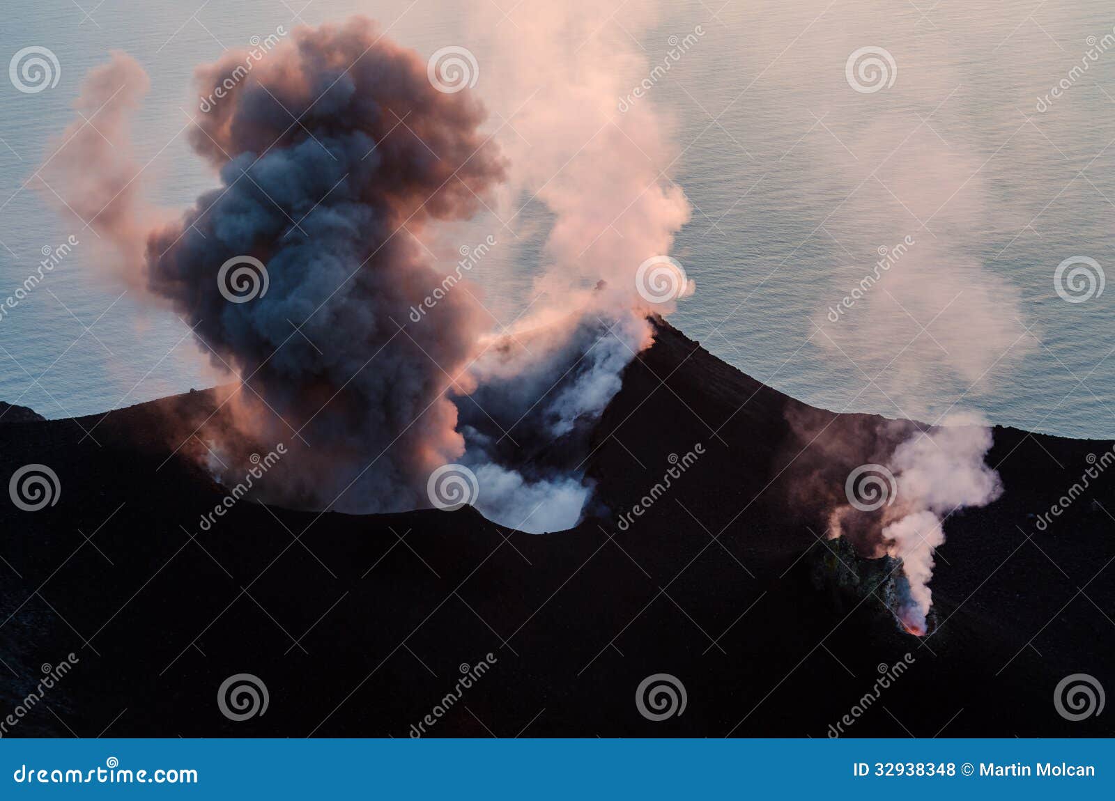 smoking erupting volcano on stromboli island, sicily