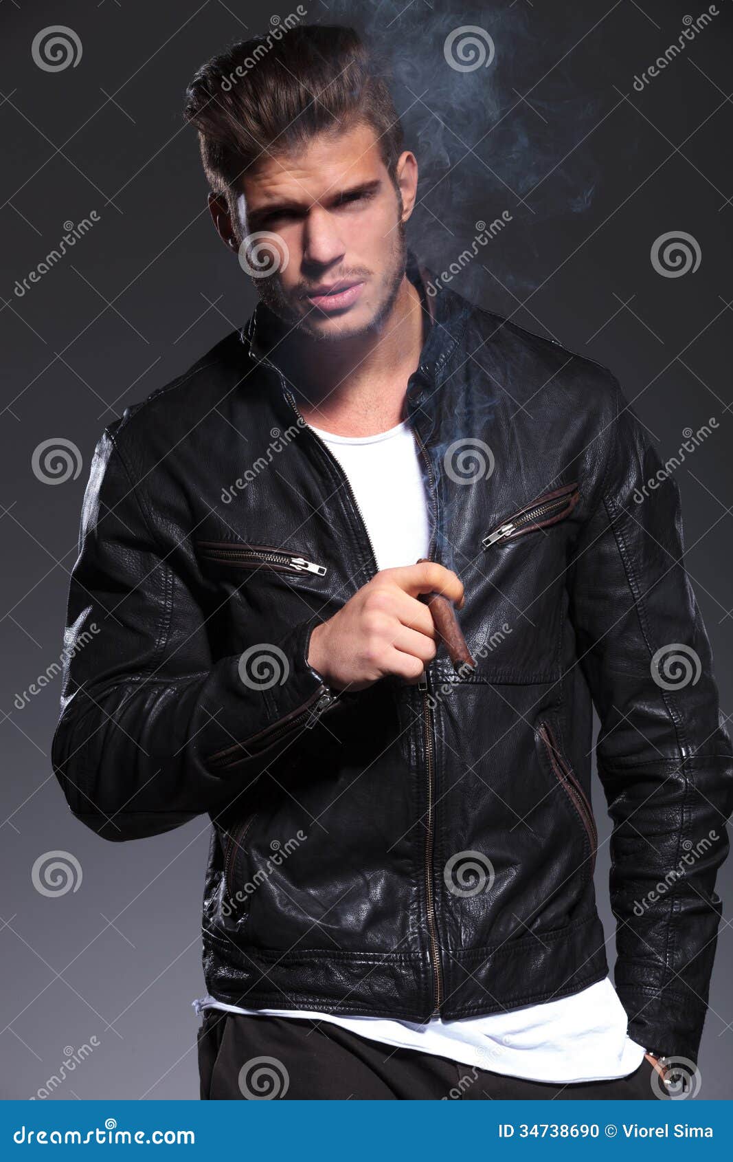 Smoking Young Man In Leather Jacket Stock Photo - Image 