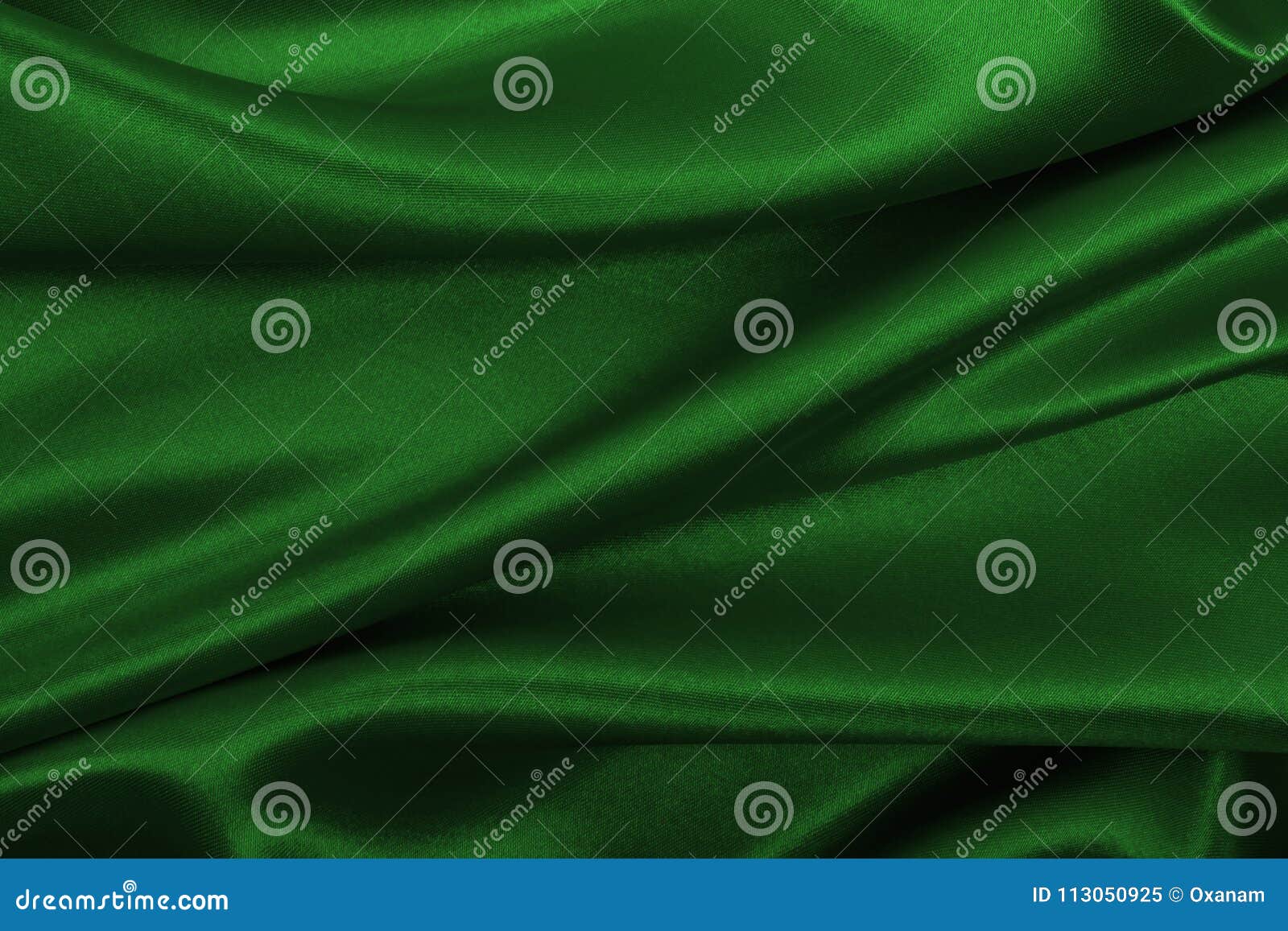 smooth elegant green silk or satin luxury cloth texture as abstract background. luxurious background 