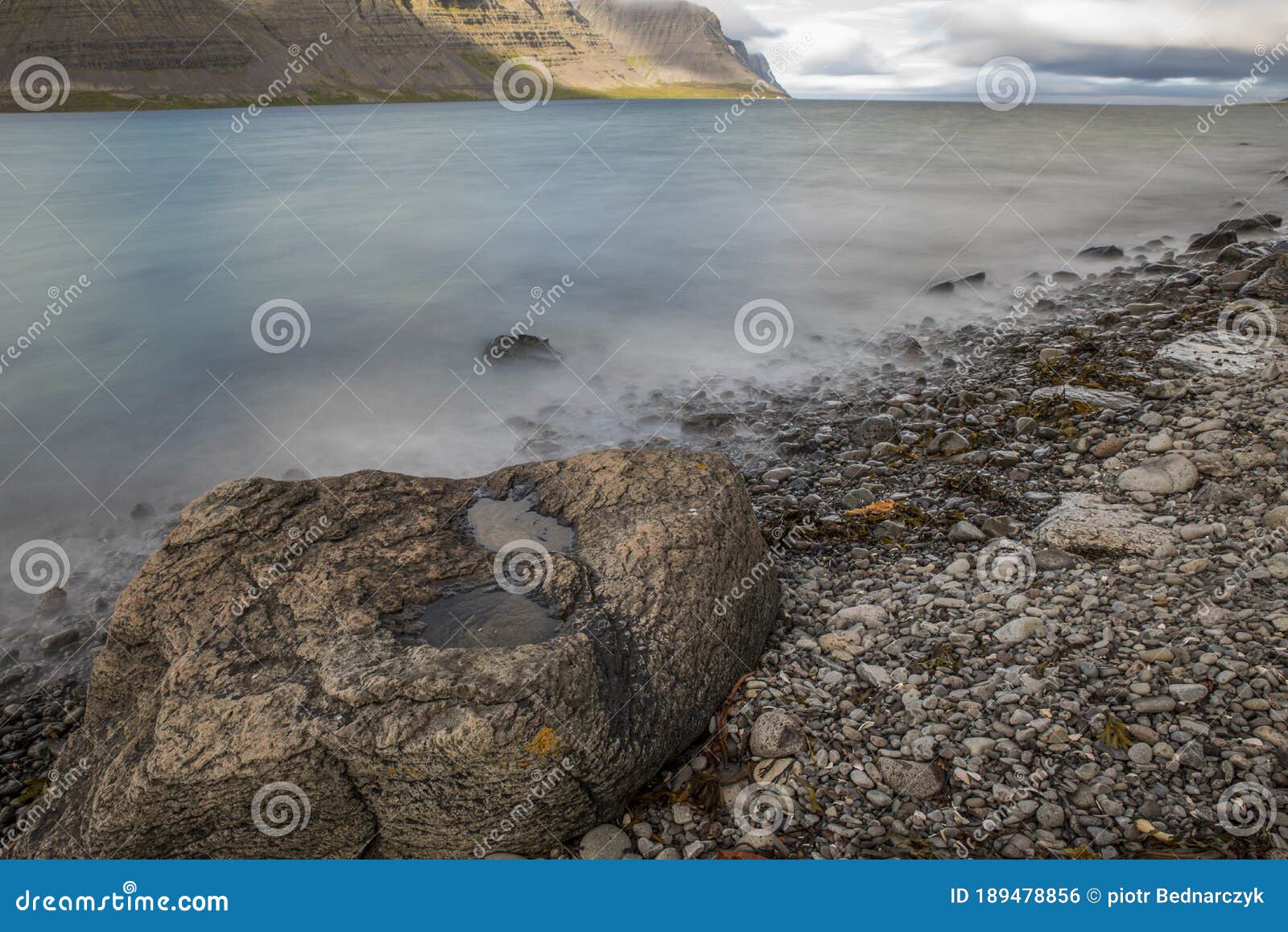 smooth ocean's surface on a long exposure photoshop in fjord on iceland