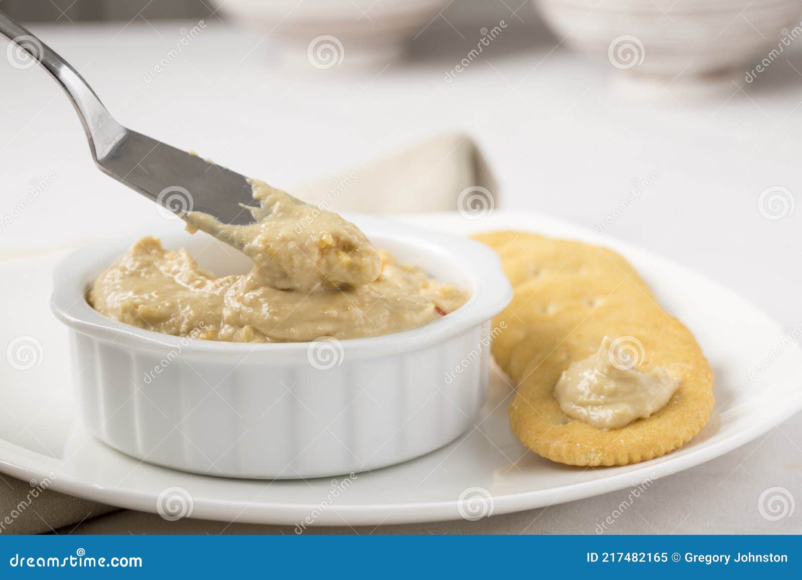 Snack crackers and hummus stock image. Image of dish 217482165
