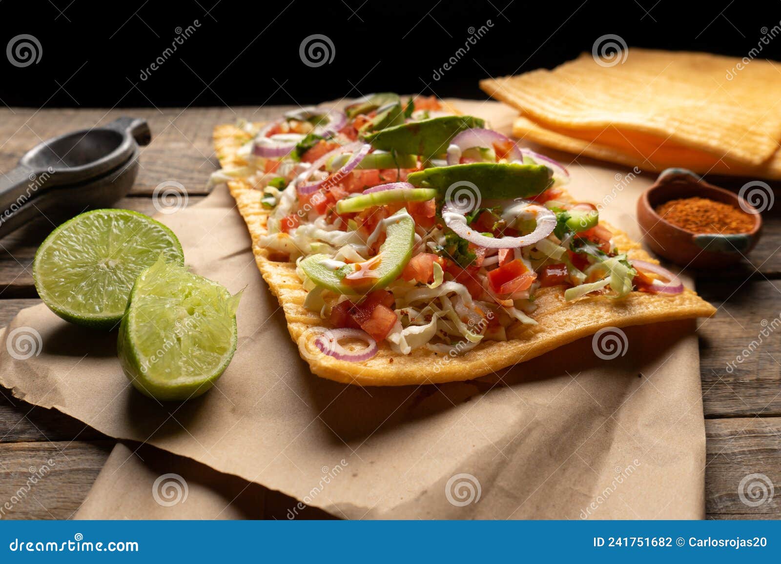 snack made with wheat flour called chicharron preparado with sauce and vegetables. mexican food