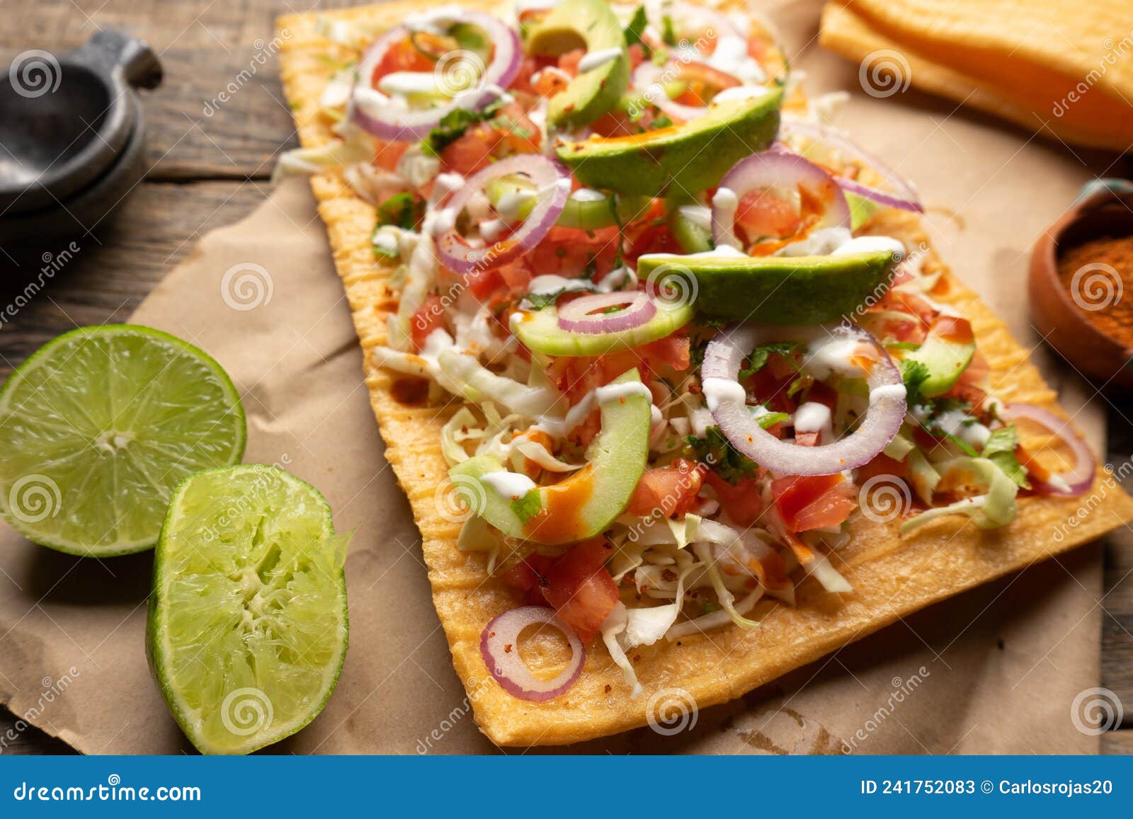 snack made with wheat flour called chicharron preparado with sauce and vegetables. mexican food