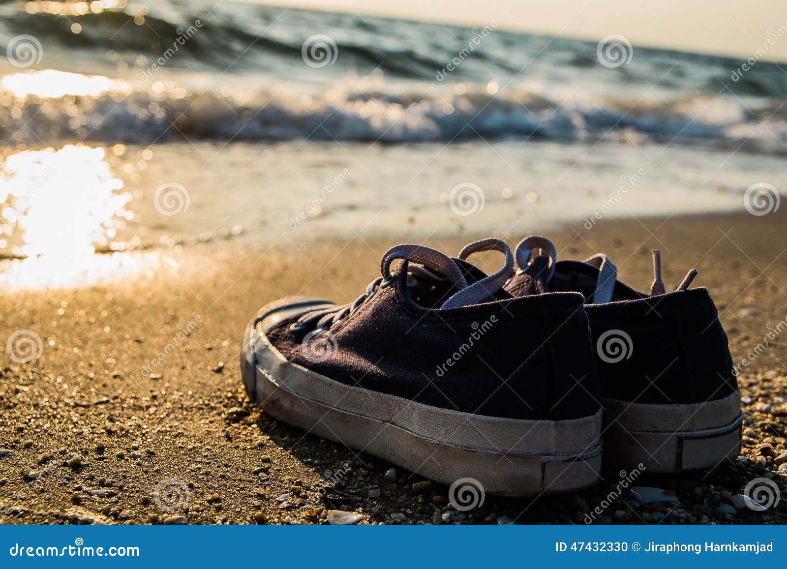 Sneakers on the beach stock photo. Image of blue, sneakers 47432330