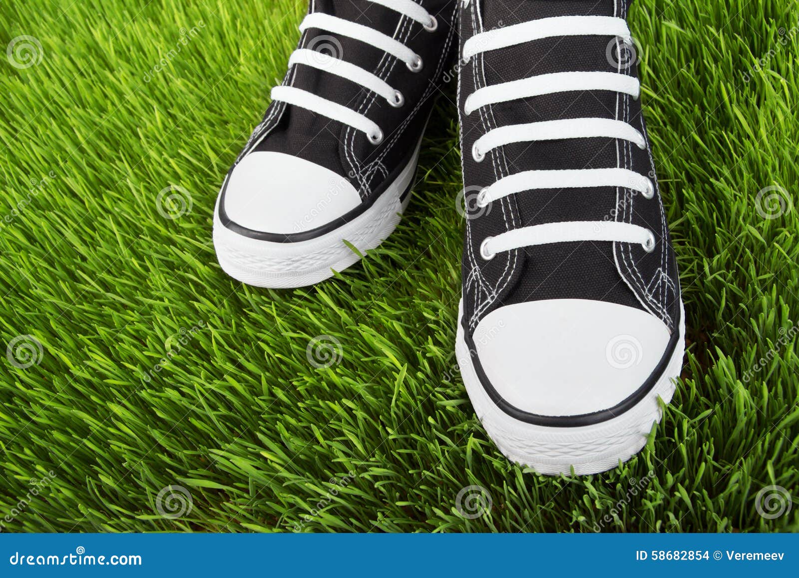 Sneakers in the Grass Field Stock Photo - Image of wear, sole: 58682854