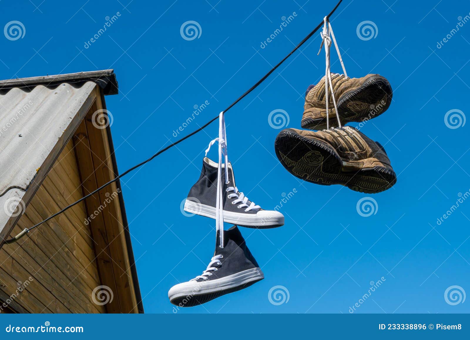 Sneakers Hanging on Electric Wires Editorial Photo - Image of assorted ...