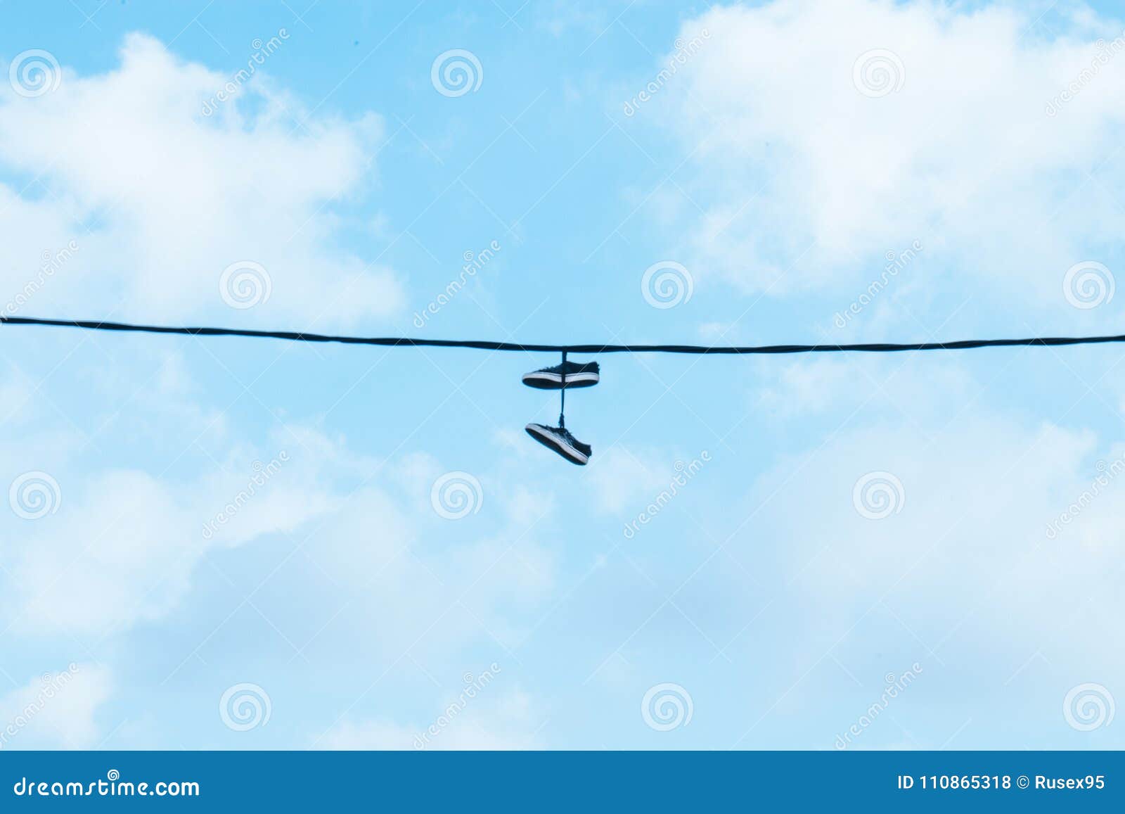 Sneakers / Shoes Hanging On Power Lines Stock Photo - Image of city