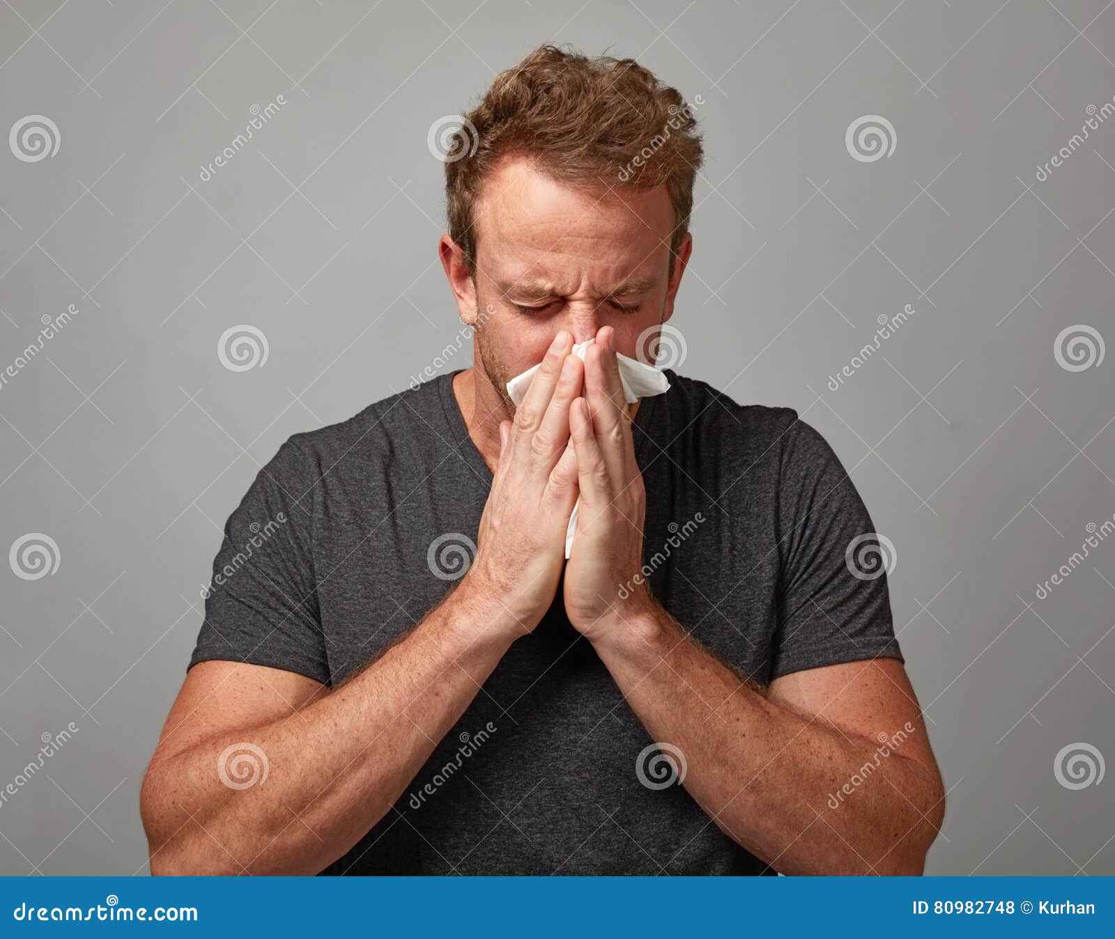 sneezing man with cold