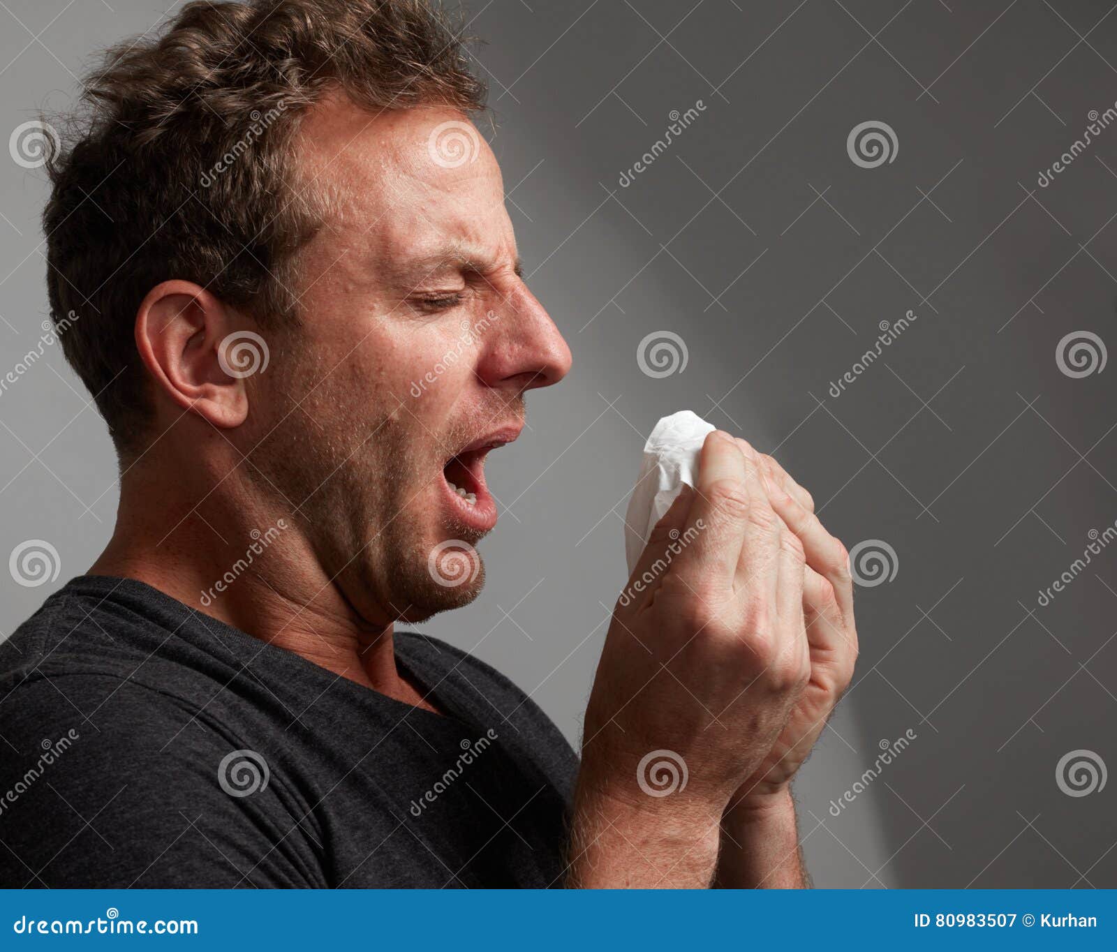 sneezing man with cold