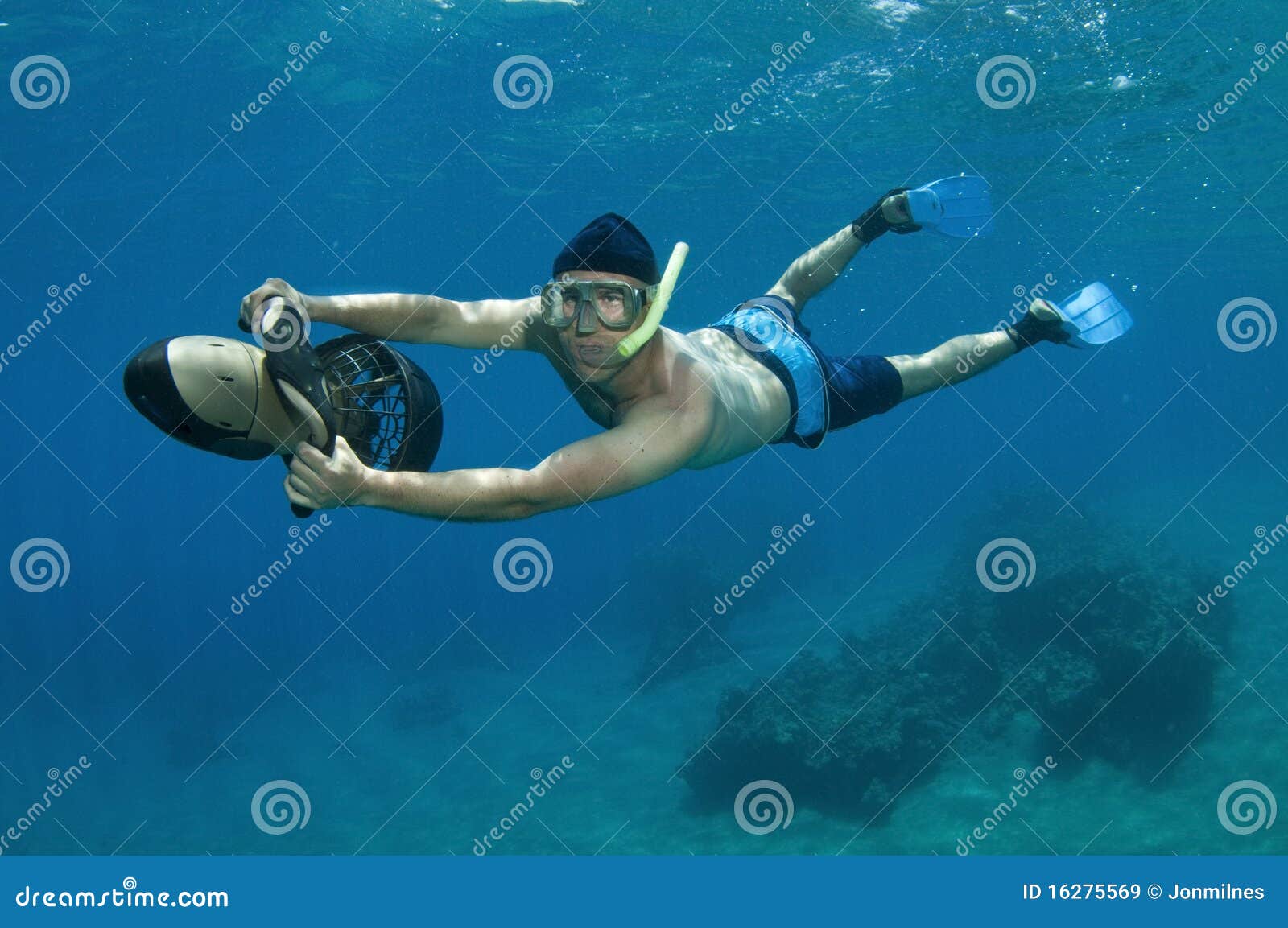 snorkeler on underwater scooter