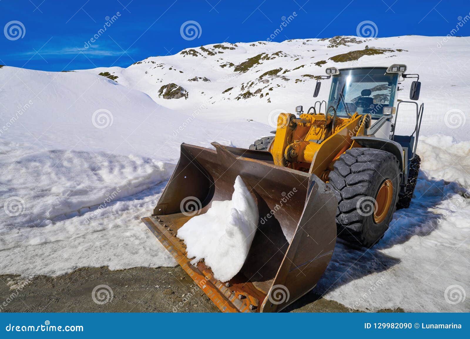 snow clearing excavator in aran valley