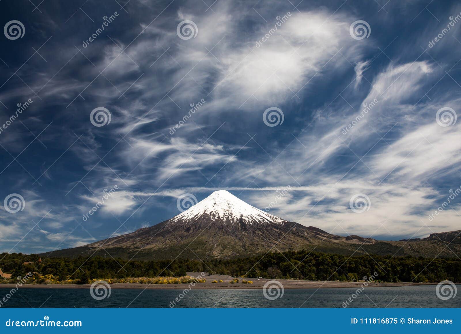 osorno volcano, a conical stratovolcano with dramatic cloudy blue sky in los lagos region, patagonia, chile