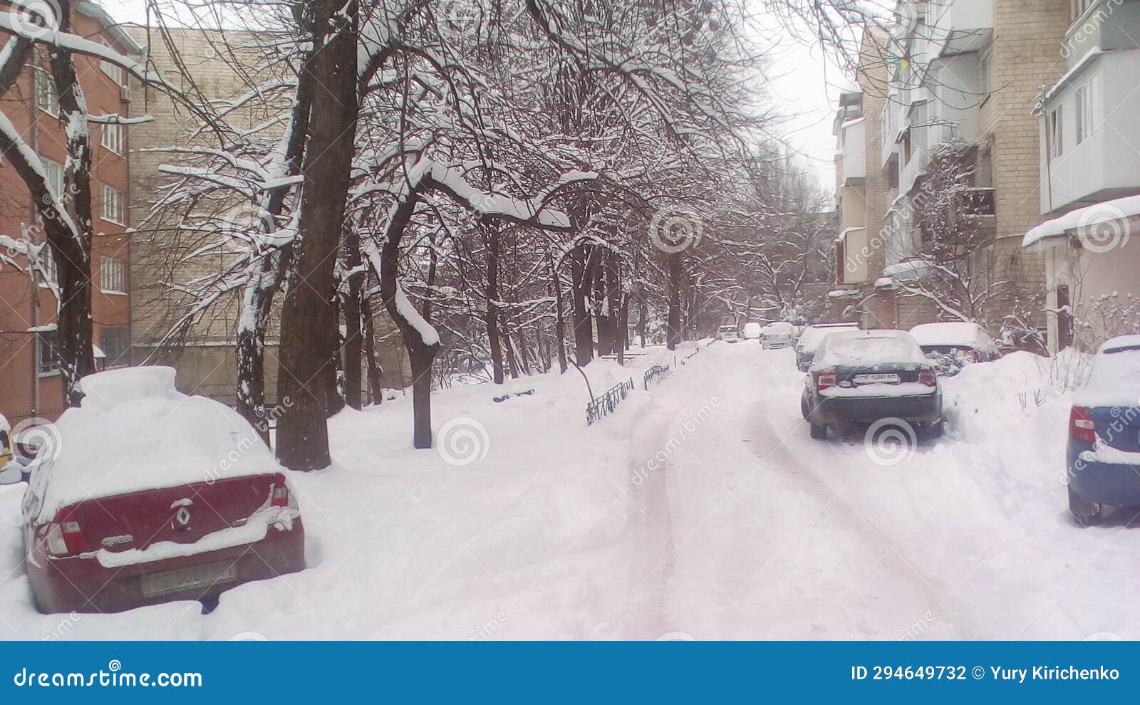 Snow Covered Road Opposite a Residential Building Stock Photo Image