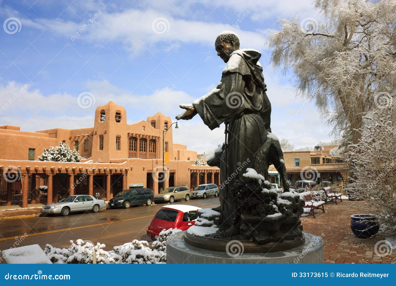 snow covered st. francis statue picturesque santa