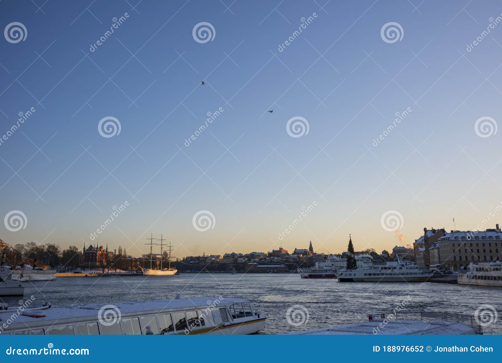 Snow Covered Water Taxis Docked Along a Harbor Stock Photo - Image of ...