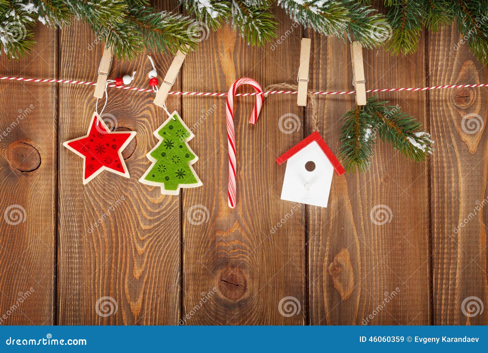 snow fir tree and christmas decor on rope