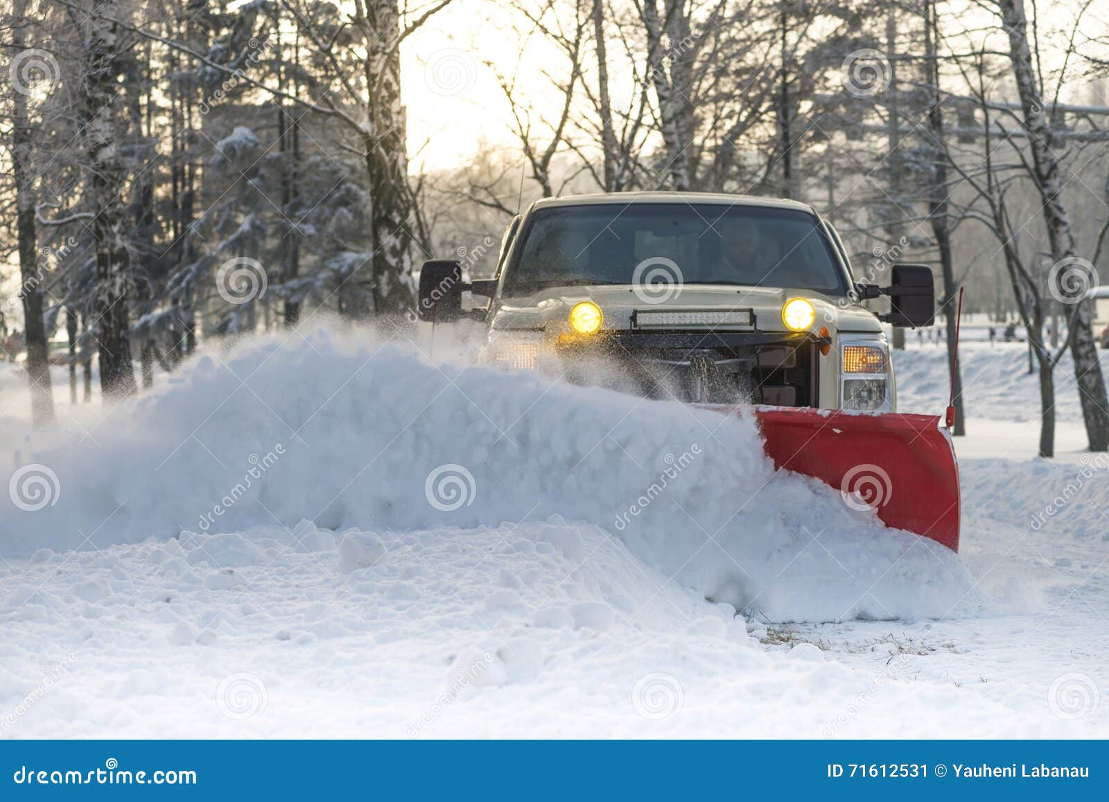 snow plow doing snow removal after a blizzard