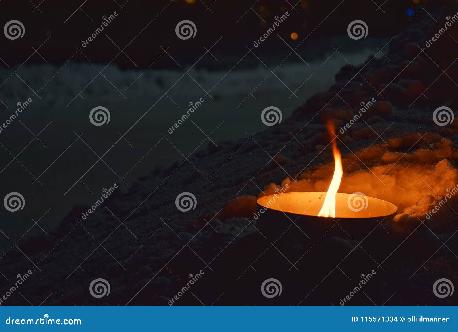 A Small Flame from a Candle Stock Photo Image of candle, snow 115571334