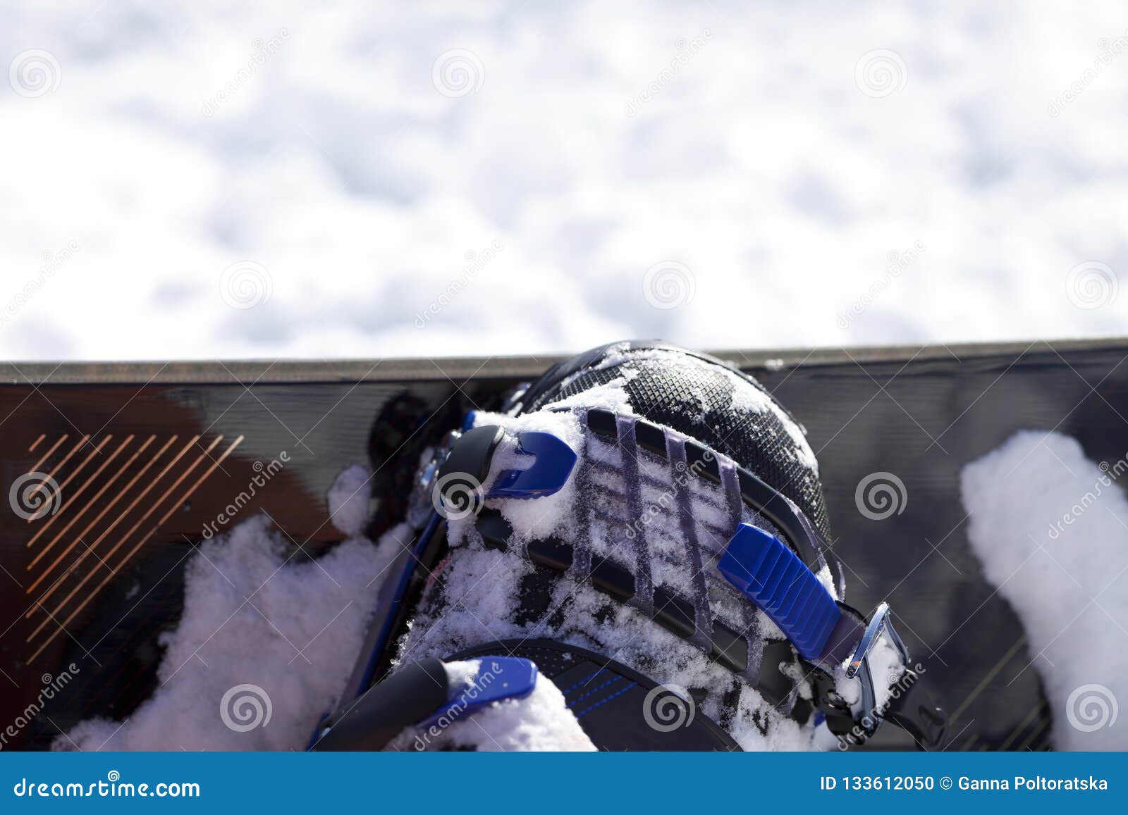 Snowboard and Boot in Binding on Ski Slope Stock Photo - Image of ...