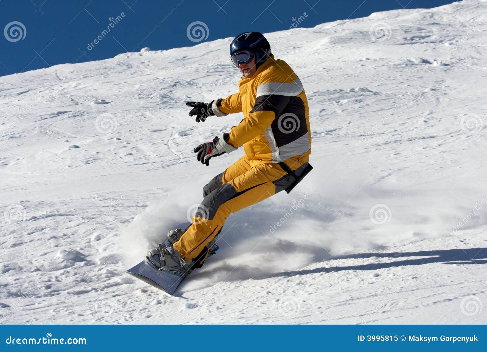 Snowboard in yellow suite stock image. Image of mogul 3995815