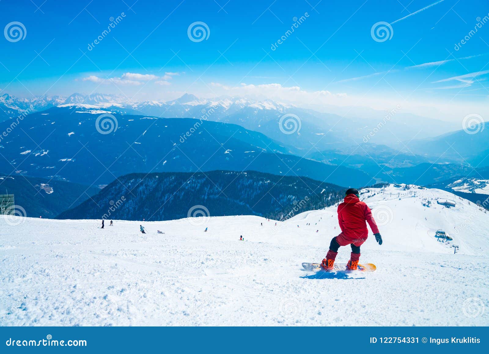 Snowboarder Going Down the Slopes in Austrian Alps through Forests