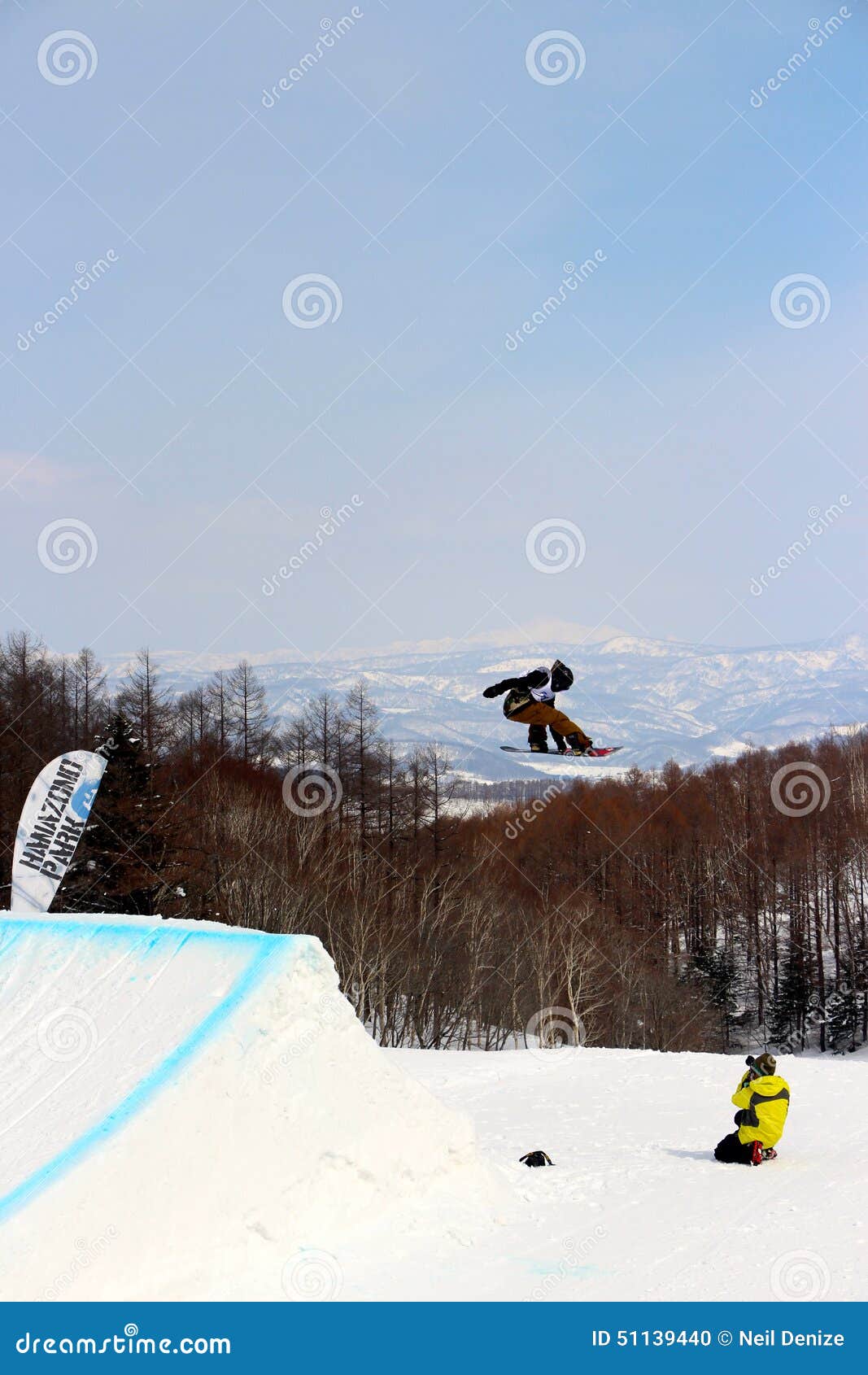 Snowboarder Going Off a Big Jump in Hanazono Park Editorial Image