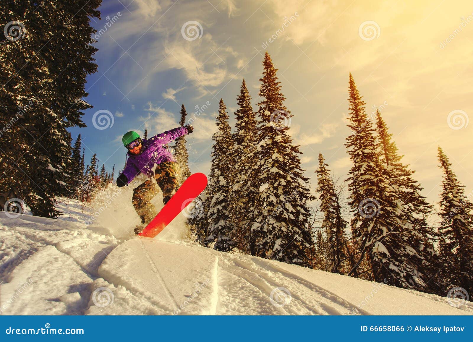 snowboarder jumping through air with deep blue sky in background