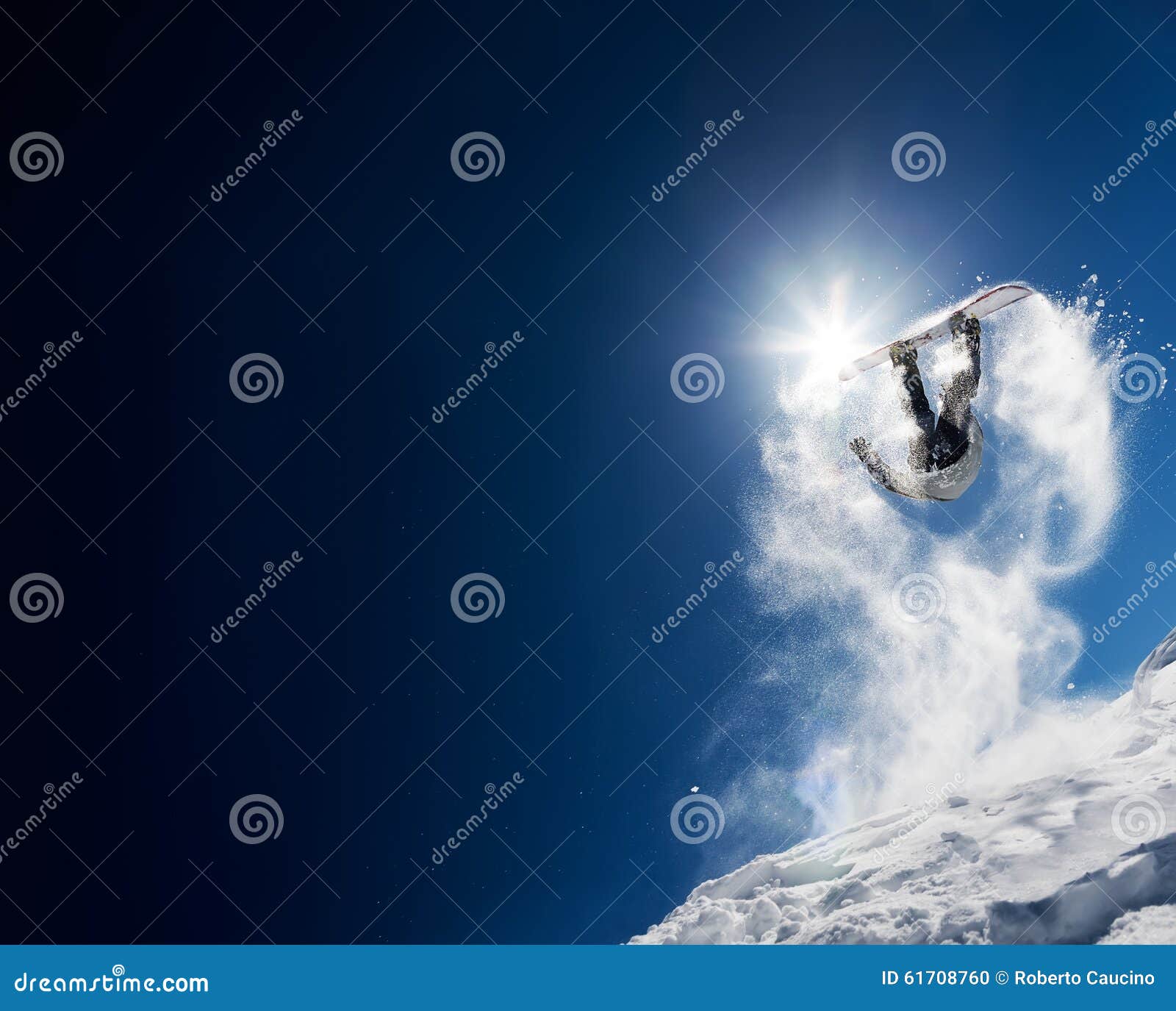 snowboarder making high jump in clear blue sky