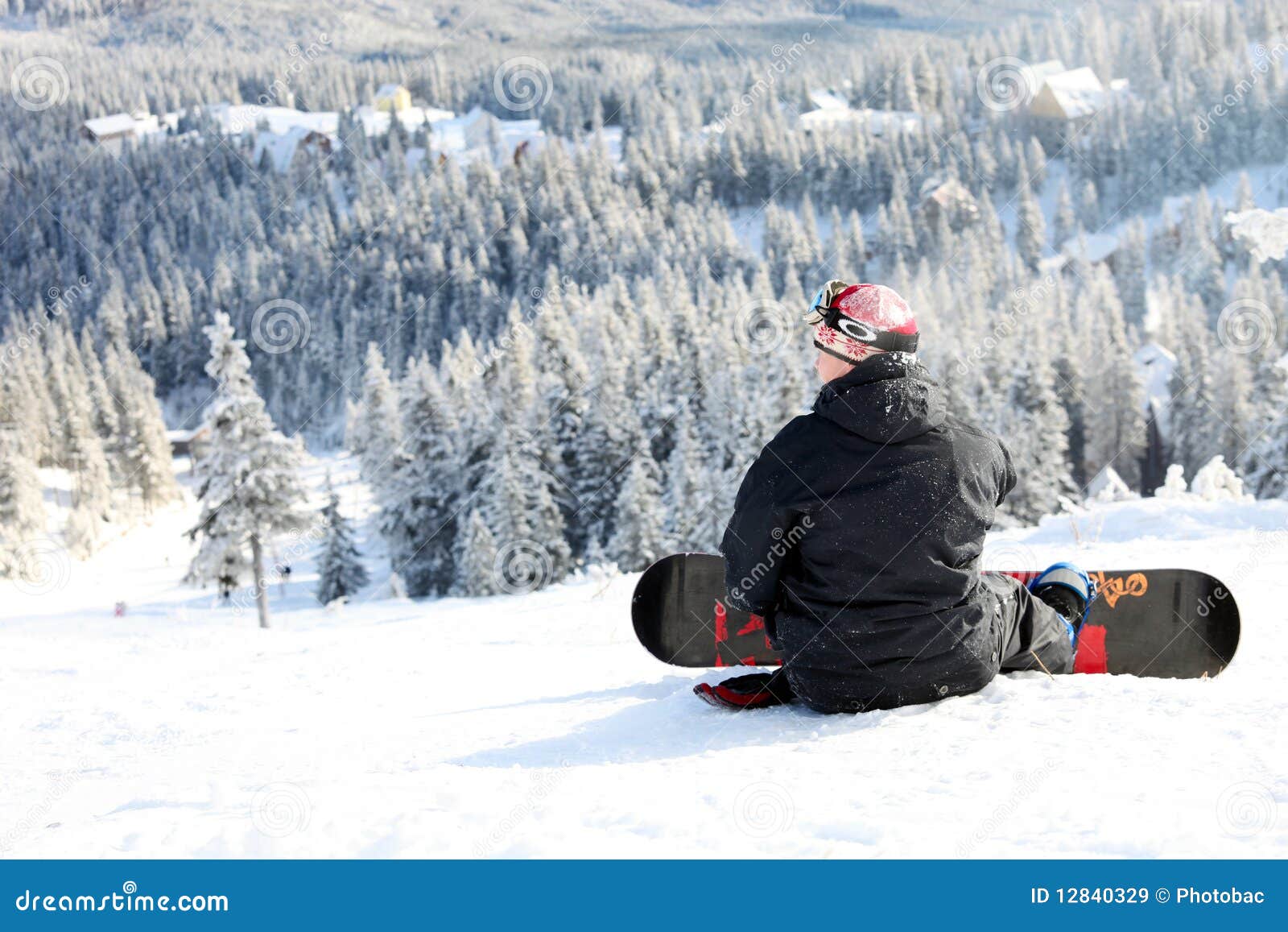 Snowboarder Sitting on a Mountain Slope Stock Image Image of slope