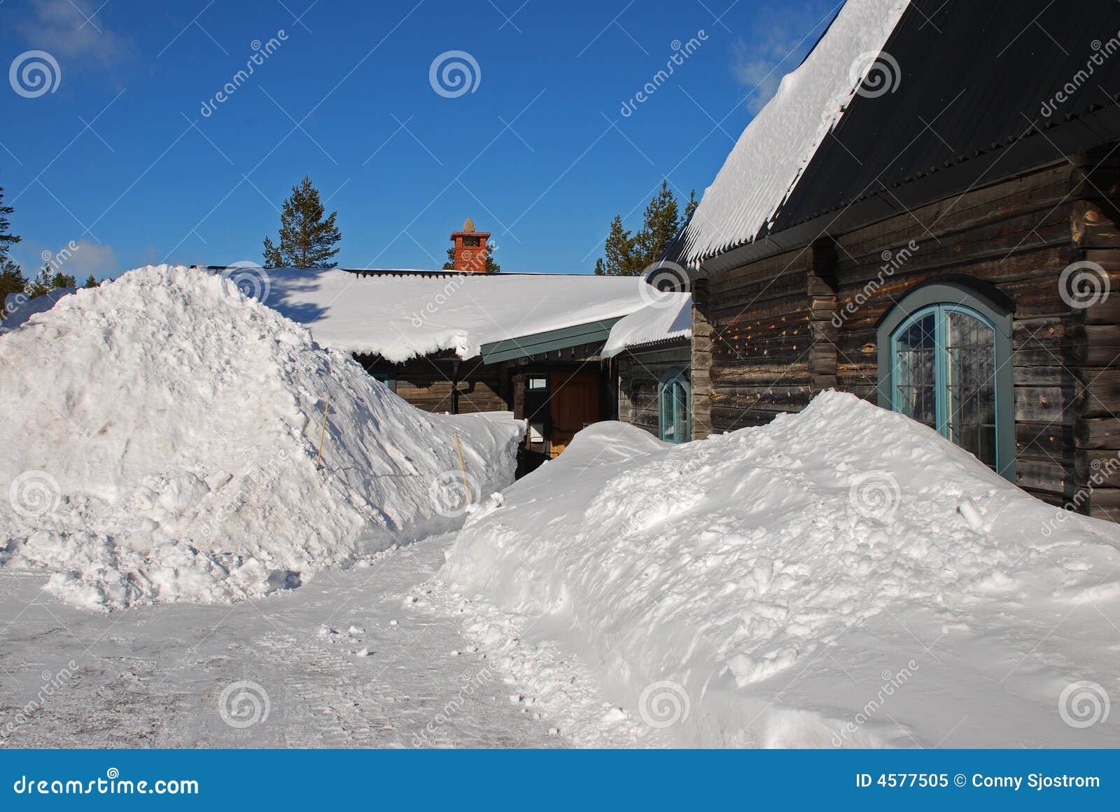 snowdrifts outside cottage