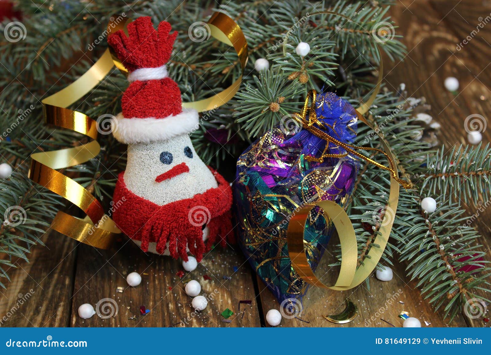 snowman near the christmas tree and candy