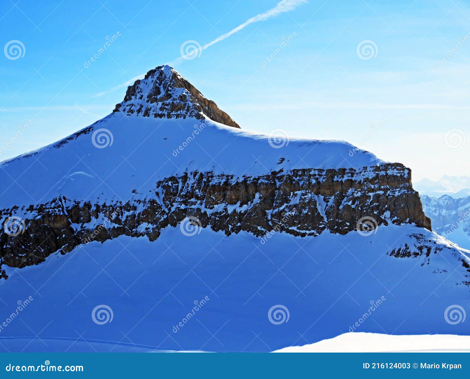 snowy alpine mountain peak oldenhorn oldehore or becca d`audon located in a mountain massif les diablerets - switzerland