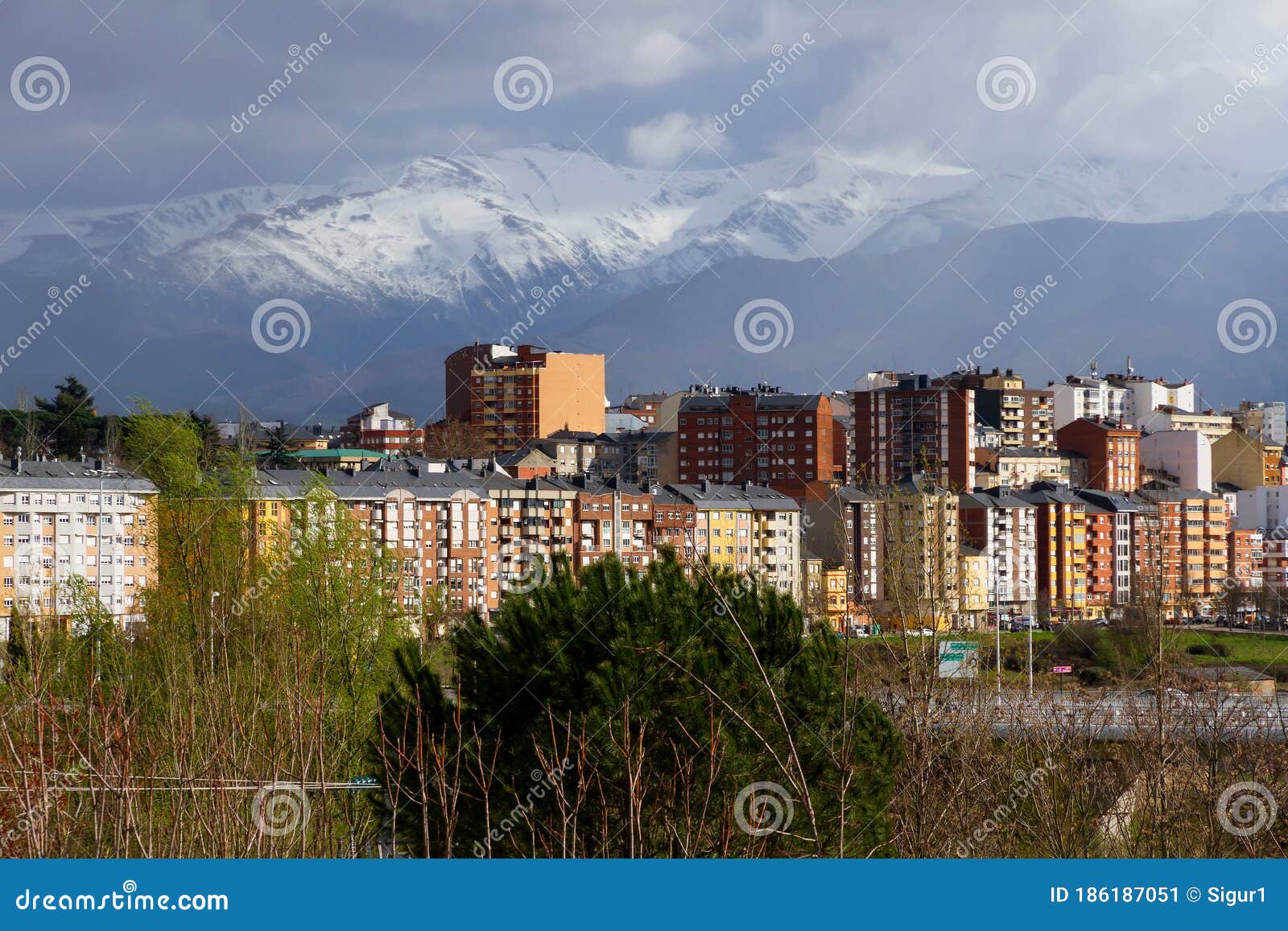 snowy mountains and city