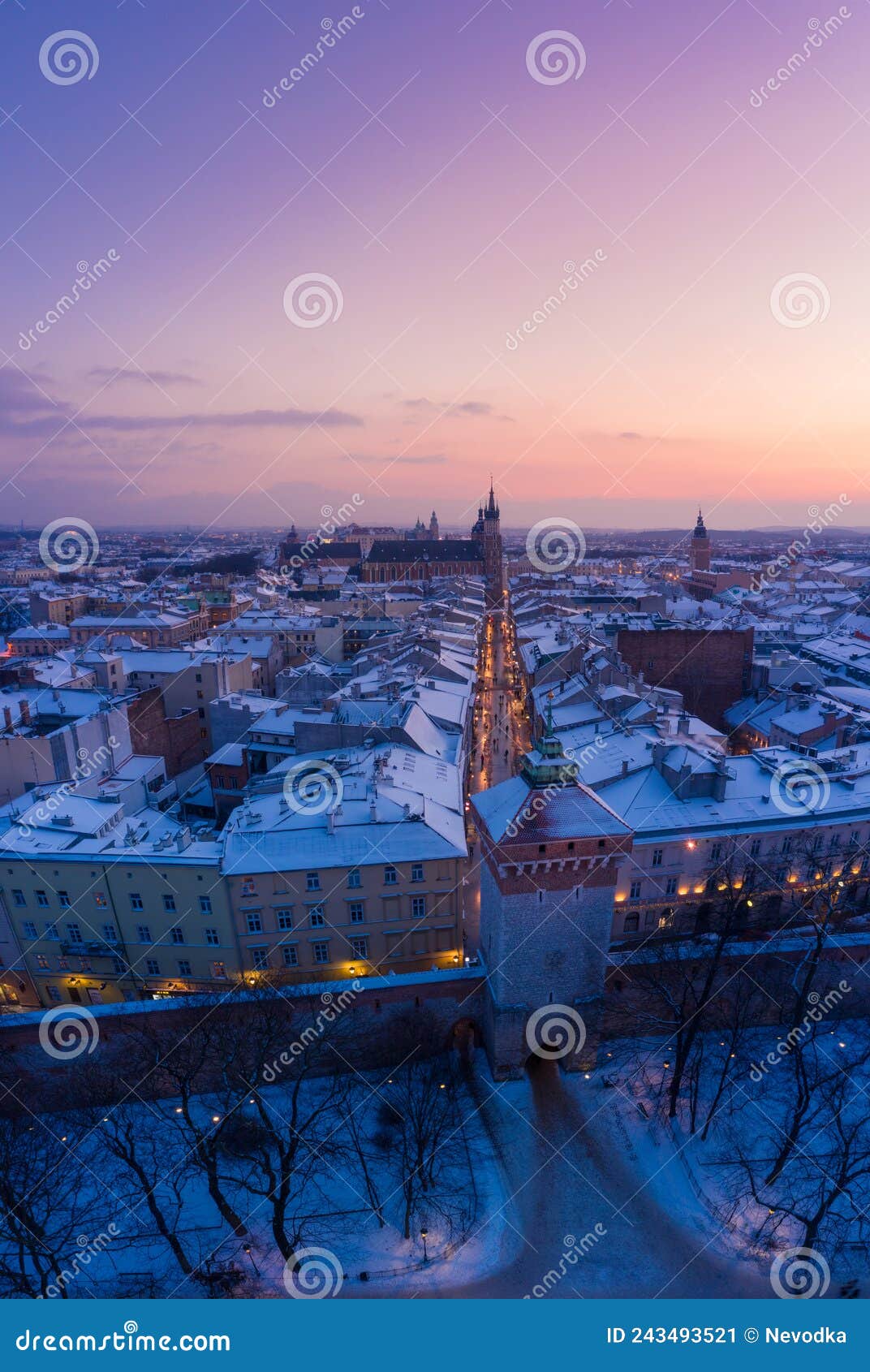 snowy winter in krakow poland aerial view vertical panorama. st. florian gate, florianska tourist walking street
