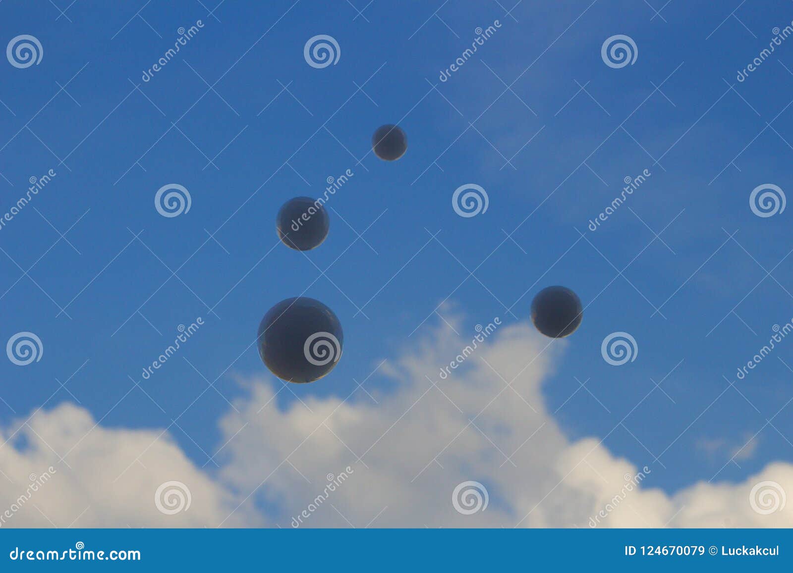 floating soap bubbles filled with smoke on sky.