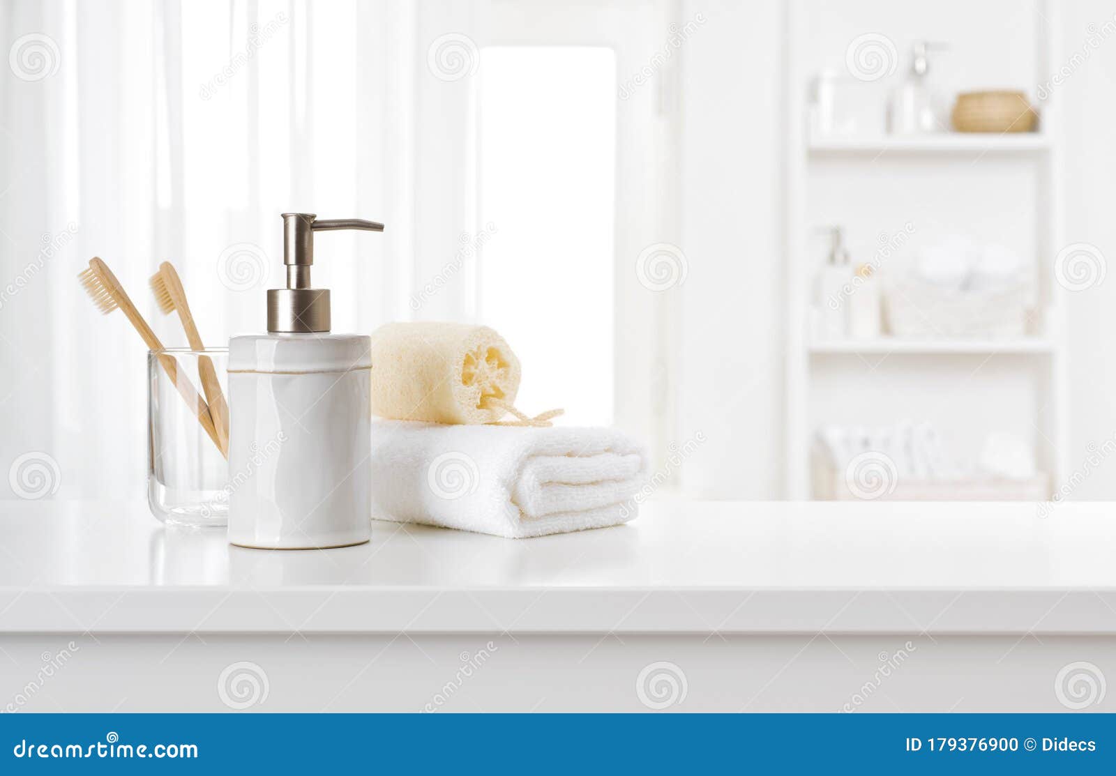 soap dispenser, toothbrushes and white towel on bathroom counter interior