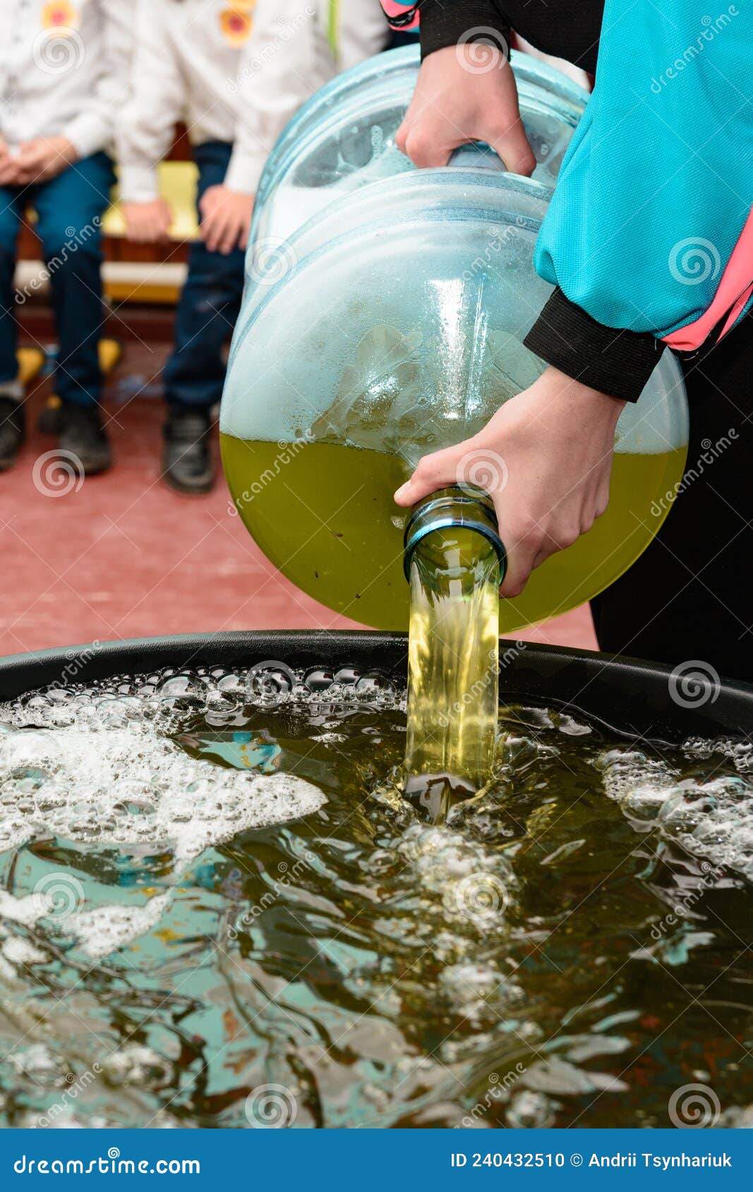 Soap Solution for the Holiday with Soap Bubbles Close Up, Soap Solution in a Vessel for Bubbles